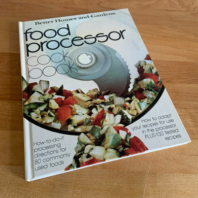 Better Homes and Gardens is known for its fabulous cookbooks. This hardcover cookbook focuses on Food Processor recipes. Its 96 pages are filled with amazing  recipes along with many colour photographs. Originally published by Meredith Corporation, USA, 1979. This is the seventh printing, 1982.   In great vintage condition with normal age-related yellowing.   