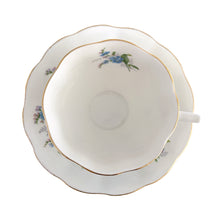 Load image into Gallery viewer, Vintage Avon shaped Forget-Me-Not bone china teacup and saucer, features a scalloped edge with hand painted blue flowers and gold gilt rim. Royal Albert, England, 1950s.  In excellent condition, free from chips, cracks and repairs. Makers marks present.  Teacup measures 3 1/4 x 2 3/4 inches | Saucer measures 5 1/2 inches
