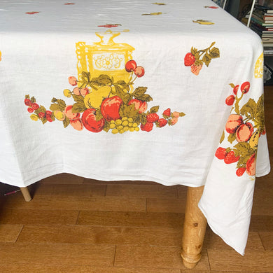 Give your table a vibrant, retro touch with this vintage white cotton tablecloth. Featuring fruits and kitchen gadgets in eye-popping orange, yellow, red, and green, it's sure to be the life of the party! Perfect for adding a hint of nostalgia to any gathering! In great vintage condition, free from stains/tears Measures 56 x 70 inches