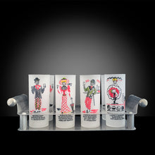 Load image into Gallery viewer, We are thrilled to offer this fabulous and rare set of eight &quot;Gay Nineties&quot; frosted Tom Collins cocktail frosted glass tumblers in a steel caddy with rolled handles. Each glass is hand painted with a unique figural design and a &quot;Here&#39;s to...&quot; toast painted below the illustration. The colours include raspberry and black with touches of yellow and green. Designed and crafted by Gay Fad Studios, USA, 1951. If you&#39;re a barware aficionado, don&#39;t miss an opportunity to own this piece of American glass history!
