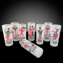 Load image into Gallery viewer, We are thrilled to offer this fabulous and rare set of eight &quot;Gay Nineties&quot; frosted Tom Collins cocktail frosted glass tumblers in a steel caddy with rolled handles. Each glass is hand painted with a unique figural design and a &quot;Here&#39;s to...&quot; toast painted below the illustration. The colours include raspberry and black with touches of yellow and green. Designed and crafted by Gay Fad Studios, USA, 1951. If you&#39;re a barware aficionado, don&#39;t miss an opportunity to own this piece of American glass history!
