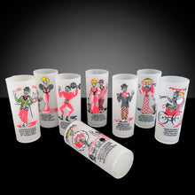 Load image into Gallery viewer, This exceptional set features eight rare vintage Gay Nineties frosted Tom Collins tumblers, each hand-painted with whimsical figural illustrations and a Here&#39;s to... toast in vibrant raspberry pink, black, yellow, and green. Presented in the original rolled-handle steel caddy, these glasses were crafted by Gay Fad Studios on Federal Glass blanks in the USA, 1951. A true treasure for collectors and connoisseurs of classic American barware, this set embodies mid-century charm and artistry.
