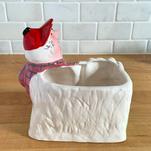 Load image into Gallery viewer, Rare vintage colourful ceramic planter featuring a gentleman hunter sporting a red cap and plaid hunting jacket gun and adorable hunting dog. Crafted by R/P, Japan, circa 1950s. An unique piece to add to your planter or hunting collection!  In excellent condition, no chips/cracks/repairs. Rifle end missing and could easily be replaced with a piece of metal  Measures 5 x 2 7/8 x 5 1/4 inches
