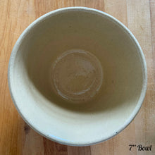 Load image into Gallery viewer, Rare find! Vintage early 20th century yellow ware mixing bowl featuring a homestead scene of girl with watering can. Crafted by Robinson Ransbottom, USA, 1930s. A well-crafted piece of stoneware offering a nostalgic vibe to your farmhouse or cottage kitchenware and decor!

In excellent condition, no chips/cracks/repairs, age-related crazing. Marked and 166-7 U.S.A.

Measures 7 x 4 inches
