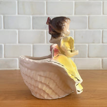 Load image into Gallery viewer, Adorable vintage mid-century era girl in a yellow dress ceramic planter 502. Crafted by Rubens Originals, Japan, 1950s. Use for tiny plants or repurpose to hold accessories.

In as found vintage condition, bow is chipped at the back, no cracks/repairs.

Measures 4 1/2 x 4 x 4 1/2 inches
