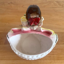 Load image into Gallery viewer, Adorable vintage mid-century era girl in a yellow dress ceramic planter 502. Crafted by Rubens Originals, Japan, 1950s. Use for tiny plants or repurpose to hold accessories.

In as found vintage condition, bow is chipped at the back, no cracks/repairs.

Measures 4 1/2 x 4 x 4 1/2 inches
