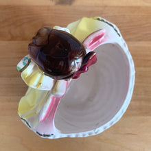 Load image into Gallery viewer, Adorable vintage mid-century era girl in a yellow dress ceramic planter 502. Crafted by Rubens Originals, Japan, 1950s. Use for tiny plants or repurpose to hold accessories.

In as found vintage condition, bow is chipped at the back, no cracks/repairs.

Measures 4 1/2 x 4 x 4 1/2 inches
