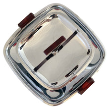 Load image into Gallery viewer, Overhead view of Glo-Hill Gourmates chrome 2-tier tidbit tray showing the square upper tray, central amber Bakelite handle bar, and two amber handles
