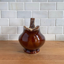 Load image into Gallery viewer, Vintage glossy brown drip glazed ceramic handled gravy boat. Crafted by Hull Pottery, USA, 1960s. A beautiful piece to add to your art pottery tableware collection!

In excellent condition, no chips/cracks/repairs. Maker&#39;s marks.

Measures 10 3/8 x 4 1/4 x 5 5/8 inches
