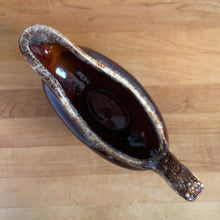 Load image into Gallery viewer, Vintage glossy brown drip glazed ceramic handled gravy boat. Crafted by Hull Pottery, USA, 1960s. A beautiful piece to add to your art pottery tableware collection!

In excellent condition, no chips/cracks/repairs. Maker&#39;s marks.

Measures 10 3/8 x 4 1/4 x 5 5/8 inches
