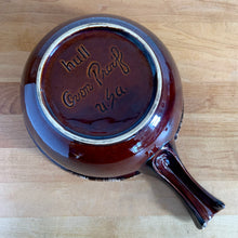Load image into Gallery viewer, Vintage glossy brown drip glazed ceramic handled soup serving bowl. Crafted by Hull Pottery, USA, 1960s. A beautiful piece to add to your&nbsp; art pottery tableware collection!

In excellent condition, no chips/cracks/repairs. Maker&#39;s marks.

Measures 8 1/4 x 3 5/8 (12 x 3 5/8 inches with handle)
