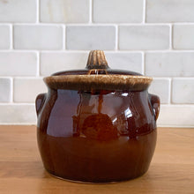 Load image into Gallery viewer, Vintage glossy brown drip glazed covered sugar bowl. Crafted by Hull Pottery, USA, 1960s. A beautiful piece to add to your tableware!

In excellent condition, no chips/cracks/repairs. Maker&#39;s marks.

Measures 4 x 4 1/4 inches
