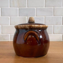 Load image into Gallery viewer, Vintage glossy brown drip glazed covered sugar bowl. Crafted by Hull Pottery, USA, 1960s. A beautiful piece to add to your tableware!

In excellent condition, no chips/cracks/repairs. Maker&#39;s marks.

Measures 4 x 4 1/4 inches
