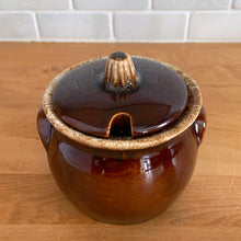 Load image into Gallery viewer, Vintage glossy brown drip glazed covered sugar bowl. Crafted by Hull Pottery, USA, 1960s. A beautiful piece to add to your tableware!

In excellent condition, no chips/cracks/repairs. Maker&#39;s marks.

Measures 4 x 4 1/4 inches
