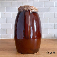 Load image into Gallery viewer, Vintage glossy brown drip glazed ceramic pitcher. Crafted by Hull Pottery, USA, 1960s. A beautiful piece to add to your home decor or art pottery collection!

In excellent condition, no chips/cracks/repairs. Maker&#39;s marks.

Measurements

Large: 5 x 9 inches, 72 ounces
