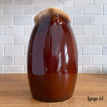 Load image into Gallery viewer, Vintage glossy brown drip glazed ceramic pitcher. Crafted by Hull Pottery, USA, 1960s. A beautiful piece to add to your home decor or art pottery collection!

In excellent condition, no chips/cracks/repairs. Maker&#39;s marks.

Measurements

Large: 5 x 9 inches, 72 ounces
