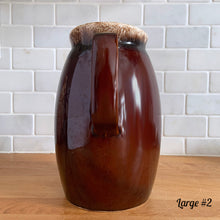 Load image into Gallery viewer, Vintage glossy brown drip glazed ceramic pitcher. Crafted by Hull Pottery, USA, 1960s. A beautiful piece to add to your home decor or art pottery collection!

In excellent condition, no chips/cracks/repairs. Maker&#39;s marks.

Measurements

Large: 5 x 9 inches, 72 ounces
