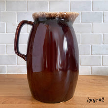 Load image into Gallery viewer, Vintage glossy brown drip glazed ceramic pitcher. Crafted by Hull Pottery, USA, 1960s. A beautiful piece to add to your home decor or art pottery collection!

In excellent condition, no chips/cracks/repairs. Maker&#39;s marks.

Measurements

Large: 5 x 9 inches, 72 ounces

