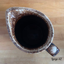 Load image into Gallery viewer, Vintage glossy brown drip glazed ceramic pitcher. Crafted by Hull Pottery, USA, 1960s. A beautiful piece to add to your home decor or art pottery collection!

In excellent condition, no chips/cracks/repairs. Maker&#39;s marks.

Measurements

Large: 5 x 9 inches, 72 ounces
