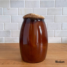 Load image into Gallery viewer, Vintage glossy brown drip glazed ceramic pitcher. Crafted by Hull Pottery, USA, 1960s. A beautiful piece to add to your home decor or art pottery collection!

In excellent condition, no chips/cracks/repairs. Maker&#39;s marks.

Measurements

Medium: 4 x 6 3/4 inches, 32 ounces

