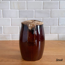 Load image into Gallery viewer, Vintage glossy brown drip glazed ceramic pitcher. Crafted by Hull Pottery, USA, 1960s. A beautiful piece to add to your home decor or art pottery collection!

In excellent condition, no chips/cracks/repairs. Maker&#39;s marks.

Measurements

Small: 2 3/4 x 4 1/2 inches, 8 ounces
