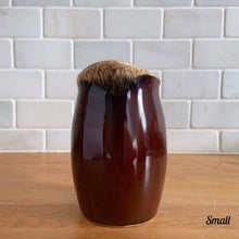 Load image into Gallery viewer, Vintage glossy brown drip glazed ceramic pitcher. Crafted by Hull Pottery, USA, 1960s. A beautiful piece to add to your home decor or art pottery collection!

In excellent condition, no chips/cracks/repairs. Maker&#39;s marks.

Measurements

Small: 2 3/4 x 4 1/2 inches, 8 ounces
