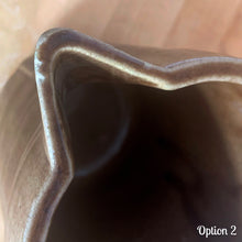 Load image into Gallery viewer, Vintage gloss brown stoneware pitcher with stacked chevron detail. Crafted by Monmouth Western Stoneware, USA, 1920s. Add this utilitarian piece to your farmhouse decor or art pottery collection!

In as found vintage condition, chip to the spout, no cracks/repairs, age-related crazing. Unmarked.

Measures 4 1/2 x 5 inches
