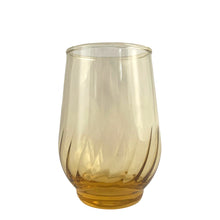 Load image into Gallery viewer, Vintage gold honey Regal 6oz flat glass tumbler featuring an swirl optic pattern. Crafted by Anchor Hocking, USA, 1970s. A lovely addition to your everyday drinkware or barware collection!

In excellent vintage condition, no chips.

Measures 2 1/2 x 3 5/8 inches

Capacity 6 ounces

