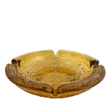 Load image into Gallery viewer, Vintage gold Soreno amber glass ashtray features a bark-like texture. Crafted by Anchor Hocking, USA, 1966 - 1970. A great piece for the tobacciana collector!

In excellent condition, no chips.

Measuring 8 3/4 x 2 inch
