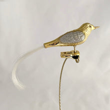 Load image into Gallery viewer, Stunning vintage gold and silver glitter glass bird clip-on Christmas tree ornament. Perfect for the tree or dress up your holiday decor.

In excellent condition.

Measures 7 1/2 inches
