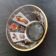 Load image into Gallery viewer, This vintage mid-century Golden Foliage flared glass ice bucket is decorated with a variety of gold leaves against alternating frosted and clear panels with gold rims. Crafted by Libbey Glass, USA, 1953 - 1978. This piece holds a good amount of ice cubes to keep your cocktails cold. Your bar cart has never looked better!

In great vintage condition, no chips, minor wear to the gold rim, but otherwise bright and shiny!

Measures 5 5/8 x 4 3/4 inches
