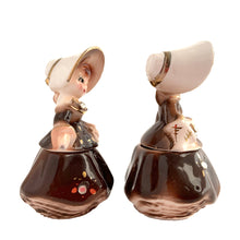 Load image into Gallery viewer, Vintage hand painted Golden Girl ceramic condiment set with tray. Enesco, Japan, 1960s. Add this pretty set to your collection!

In excellent condition, no chips/cracks/repairs.

Each girl measures 2 1/2 x 1 7/8 x 3 1/2 inches

Tray measures 6 1/4 x 2 1/8 inches
