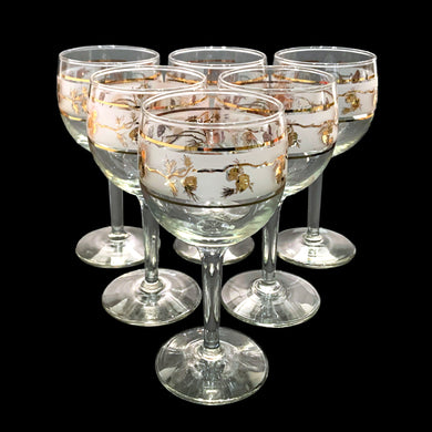 Set of six vintage Golden Pinecone wine glasses feature gold pinecones on a frosted band bordered by gold bands. Crafted by Dominion Glass, Canada, circa 1960s.

In excellent condition, no chips.

Measures 2 5/8 x 5 3/4 inches

Capacity 5 ounces