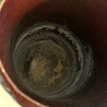 Load image into Gallery viewer, Antique brown glazed stoneware tankard or pitcher, decorated with good luck swastikas. In Native American cultures, the swastika, or Whirling Log as it&#39;s known in Navajo, was a symbol of good fortune, the vehicle of the Culture Hero, or the four winds. This design pre-dates the Nazi era. Crafted by McCoy Pottery, 1920s.

In as found vintage condition, no chips/cracks/repairs. The interior has glaze loss on the bottom and hard water marks.

Measures 7 3/4 x 5 3/4 x 8 1/4 inches (incl. spout/handle)
