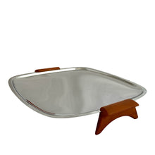 Load image into Gallery viewer, Straight out of the atomic age, this vintage &quot;Gourmates&quot; chrome serving tray features ochre Bakelite handles/legs. Crafted by Glo-Hill, Canada, circa 1960s. Delivers loads of mid-century modern style to entertaining! In great vintage condition with surface wear, but still super shiny. Measures 11 1/8 x 12 1/4 inches (incl. handles)
