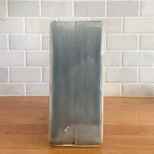 Load image into Gallery viewer, Vintage mid-century gray Arcature Line vase with central deep red bird. Crafted by McCoy Pottery, USA, early 1950s. This rare piece is must for any art pottery collector!

In excellent condition, no chips/cracks/repairs. Maker&#39;s mark.

Measures 6 1/4 x 2 7/8 x 6 1/2 inches
