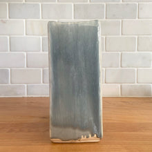 Load image into Gallery viewer, Vintage mid-century gray Arcature Line vase with central deep red bird. Crafted by McCoy Pottery, USA, early 1950s. This rare piece is must for any art pottery collector!

In excellent condition, no chips/cracks/repairs. Maker&#39;s mark.

Measures 6 1/4 x 2 7/8 x 6 1/2 inches
