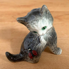 Load image into Gallery viewer, Delightful vintage gray and white cat with ladybug porcelain figurine. Crafted by Goebel, West Germany. Add this sweet figurine to your collection!

In excellent condition, no chips/cracks.

Measures 2 1/2 x 1 3/8 x 2 1/4 inches
