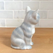Load image into Gallery viewer, Delightful vintage gray tabby cat porcelain figurine. Crafted by Otagiri, Japan. Add this sweet figurine to your collection!

In excellent condition, no chips/cracks.

Measures 2 1/4 x 1 5/8 x 3 1/2 inches
