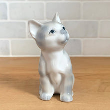 Load image into Gallery viewer, Delightful vintage gray tabby cat porcelain figurine. Crafted by Otagiri, Japan. Add this sweet figurine to your collection!

In excellent condition, no chips/cracks.

Measures 2 1/4 x 1 5/8 x 3 1/2 inches
