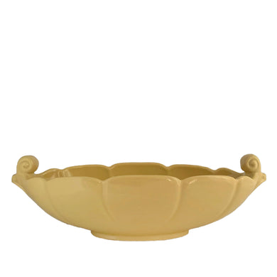 Vintage Art Deco era Grecian style ceramic pottery condole bowl in glossy butter yellow glaze. Crafted by Abingdon, USA, circa 1940s. A lovely piece to use as a centrepiece, catchall or planter.  In excellent condition, free form chips/cracks/repairs.  Measures 14 1/4 x 6 x 4 5/8 inches