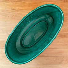 Load image into Gallery viewer, Vintage green glazed Bacchante oval planter jardiniere, shape 115, features embossed toga-clad figures with grapevine detail at the rim. Crafted by Sylvac, England, 1930s 1940s. A nice sized piece for your favourite bulbs and houseplants or use as decor.

In excellent condition, no chips/cracks/repairs.

Measures 9 1/4 x 5 3/4 x 5 1/2 inches
