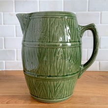 Load image into Gallery viewer, Vintage green barrel ceramic mugs and tankard pitcher set, includes six mugs and and one pitcher. Crafted by McCoy Pottery, USA, 1920s. Off the hop this set gives us all the beer, hot chocolate and cider vibes!

In excellent condition, no chips/cracks/repairs.

Mugs measure 3 3/4 x 4 5/8 inches. Capacity 18oz

Tankard Pitcher measures 5 1/4 x 8 inches. Capacity 72oz
