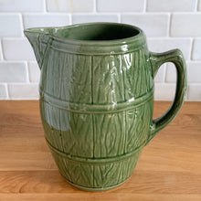 Load image into Gallery viewer, Vintage green barrel ceramic mugs and tankard pitcher set, includes six mugs and and one pitcher. Crafted by McCoy Pottery, USA, 1920s. Off the hop this set gives us all the beer, hot chocolate and cider vibes!

In excellent condition, no chips/cracks/repairs.

Mugs measure 3 3/4 x 4 5/8 inches. Capacity 18oz

Tankard Pitcher measures 5 1/4 x 8 inches. Capacity 72oz
