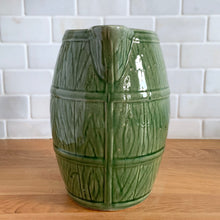 Load image into Gallery viewer, Vintage green barrel ceramic mugs and tankard pitcher set, includes six mugs and and one pitcher. Crafted by McCoy Pottery, USA, 1920s. Off the hop this set gives us all the beer, hot chocolate and cider vibes!

In excellent condition, no chips/cracks/repairs.

Mugs measure 3 3/4 x 4 5/8 inches. Capacity 18oz

Tankard Pitcher measures 5 1/4 x 8 inches. Capacity 72oz
