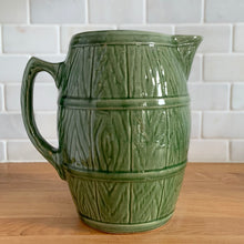 Load image into Gallery viewer, Vintage green barrel ceramic mugs and tankard pitcher set, includes six mugs and and one pitcher. Crafted by McCoy Pottery, USA, 1920s. Off the hop this set gives us all the beer, hot chocolate and cider vibes!

In excellent condition, no chips/cracks/repairs.

Mugs measure 3 3/4 x 4 5/8 inches. Capacity 18oz

Tankard Pitcher measures 5 1/4 x 8 inches. Capacity 72oz
