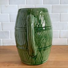 Load image into Gallery viewer, Vintage green barrel ceramic mugs and tankard pitcher set, includes six mugs and and one pitcher. Crafted by McCoy Pottery, USA, 1920s. Off the hop this set gives us all the beer, hot chocolate and cider vibes!

In excellent condition, no chips/cracks/repairs.

Mugs measure 3 3/4 x 4 5/8 inches. Capacity 18oz

Tankard Pitcher measures 5 1/4 x 8 inches. Capacity 72oz
