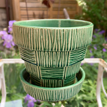 Load image into Gallery viewer, Highly collectible vintage mid-century green basketweave ceramic art pottery planter with attached underplate. Crafted by McCoy Pottery, USA, 1950s. The perfect home for your favourite houseplant or succulent. Makes a lovely gift for any gardening enthusiast.

In excellent vintage condition, no chips/cracks/repairs, age-related crazing. Maker's mark.

Measures 5 1/4 x 4 7/8 inches
