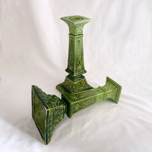 Load image into Gallery viewer, This RARE pair of antique candlesticks from Bretby Pottery are a stunning addition to any home. Crafted in pre-1920 England, they feature a moss green glaze with exquisite raised laurel leaves and rosettes. A must-have for the vintage collector!  In excellent condition. Bretby&#39;s sunburst impressed mark is on the bottom.  Measures 10 inches.
