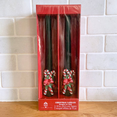 Sweet pair of green Christmas taper candles with figural red/white/green candy canes and bows. A great way to add a warm glow to your holiday decor!  Measures 10 inches. New in box.